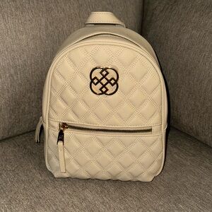 Small purse backpack in cream